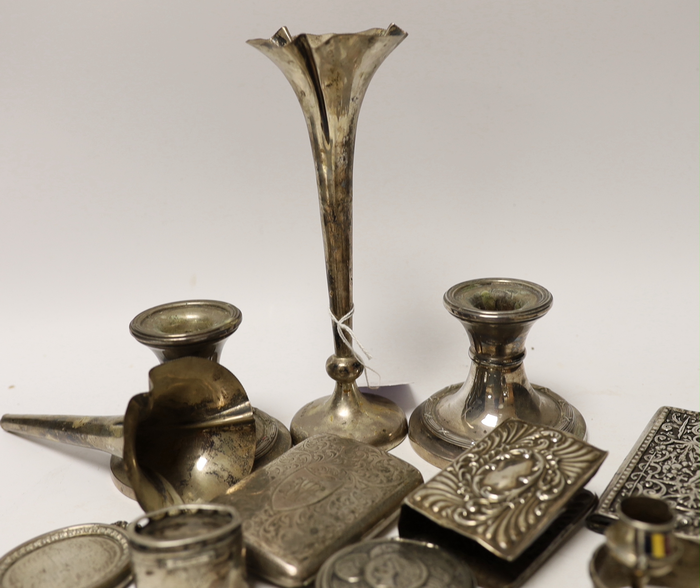 A modern pair of silver mounted dwarf candlesticks and other sundry silver items including cigarette case, medals etc.